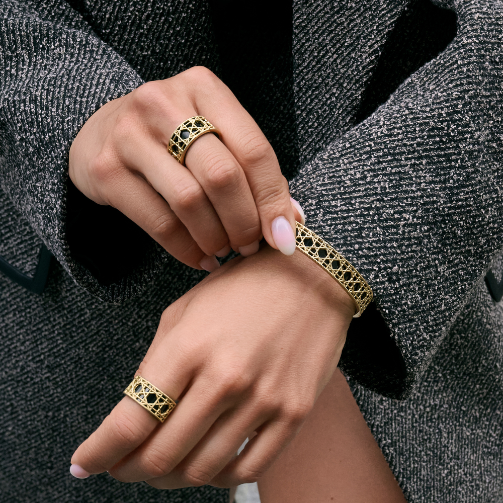Gold stainless steel openwork bracelet and matching ring with black enamel interior, geometric statement jewelry set, hypoallergenic non-tarnish durable contemporary jewelry Canada.
