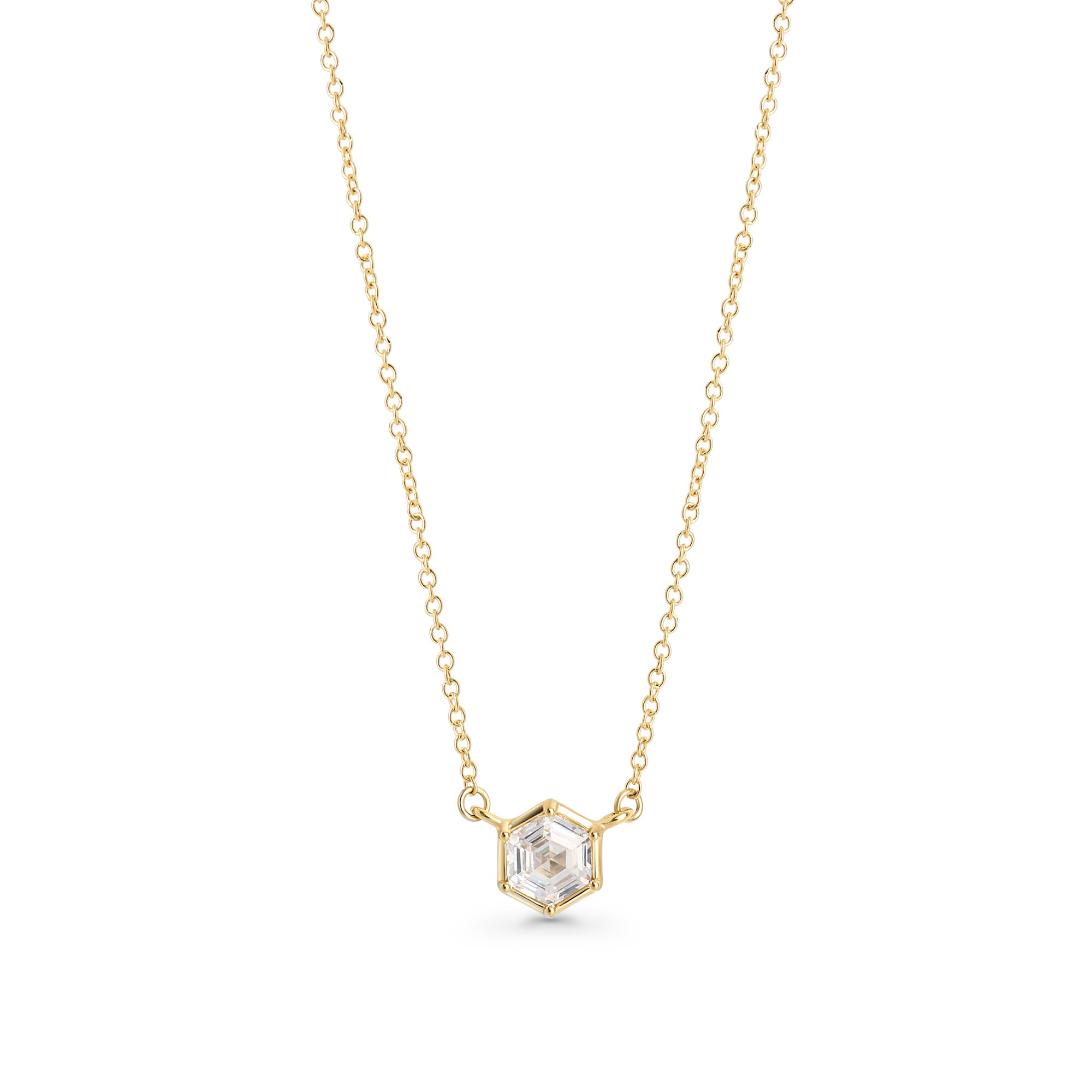 Gold stainless steel necklace with hexagon-cut cubic zirconia pendant, minimalist geometric jewelry design with brilliant stone on delicate chain.
