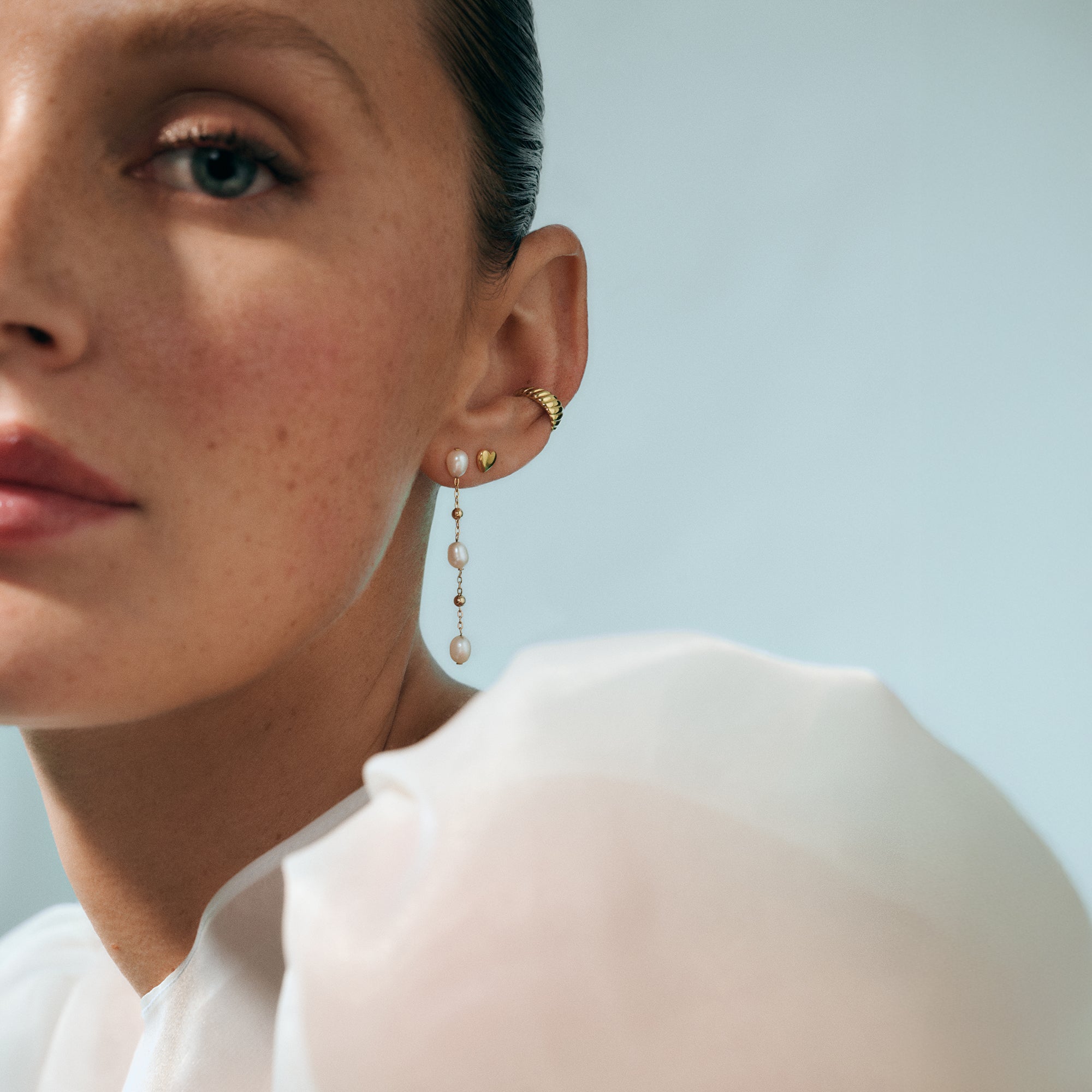 Elegant pearl drop earrings in hypoallergenic stainless steel, safe for sensitive skin, durable everyday jewelry for women in Canada.