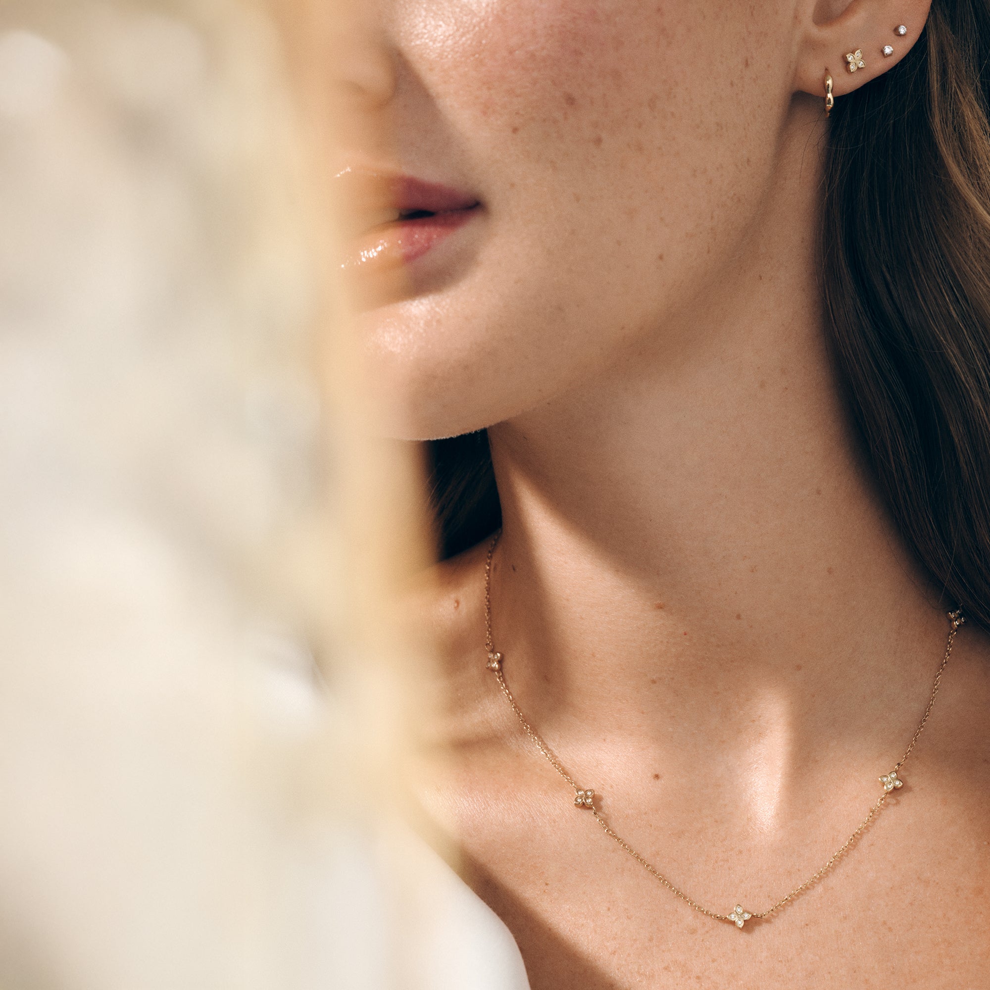 Gold stainless steel stud earrings and mini hoop stack, floral and cubic zirconia details, hypoallergenic earrings for sensitive ears, lightweight tarnish resistant jewelry in Canada.