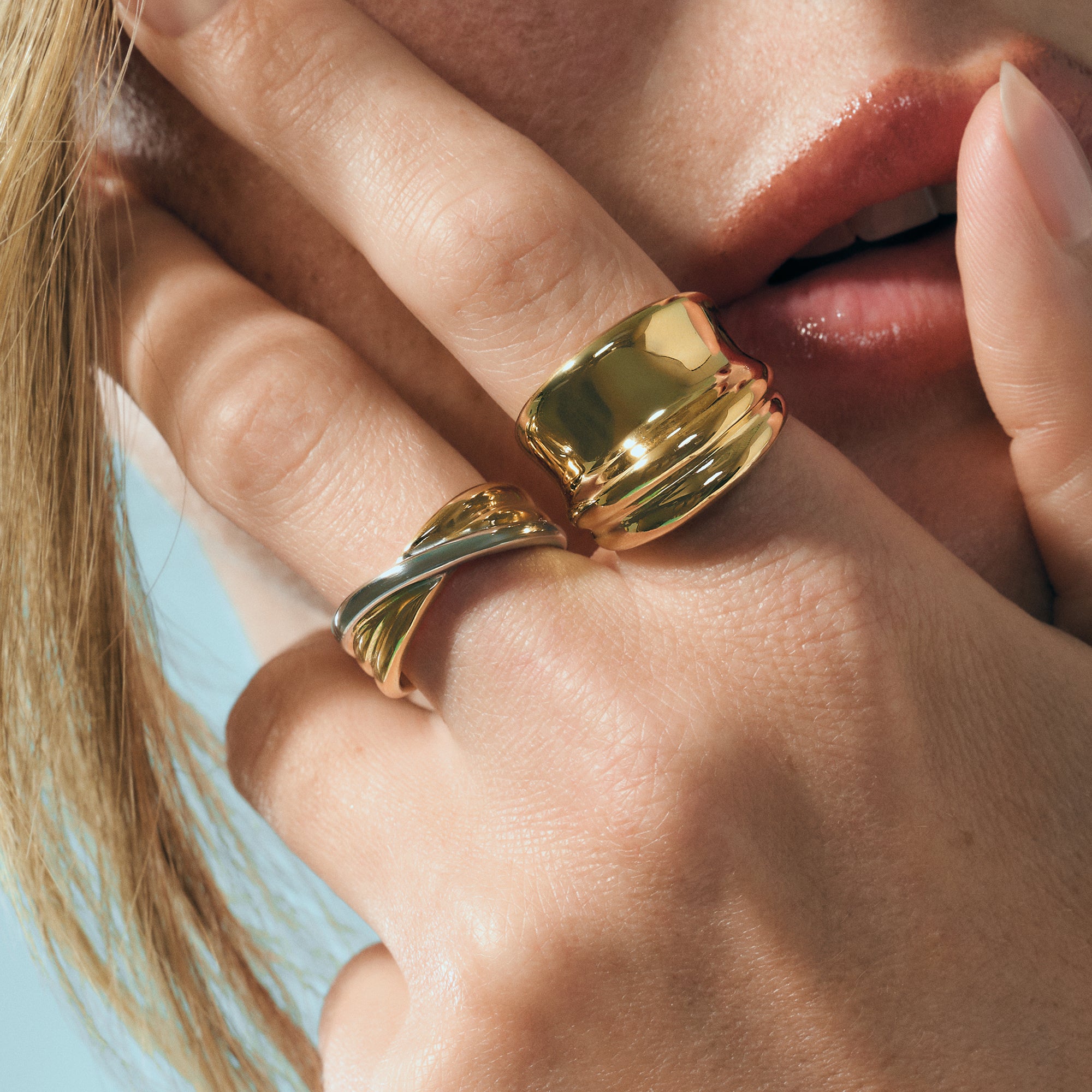 Bold gold statement rings with smooth sculptural design in surgical stainless steel, hypoallergenic jewelry for sensitive skin, durable, tarnish resistant and modern everyday luxury in Canada.