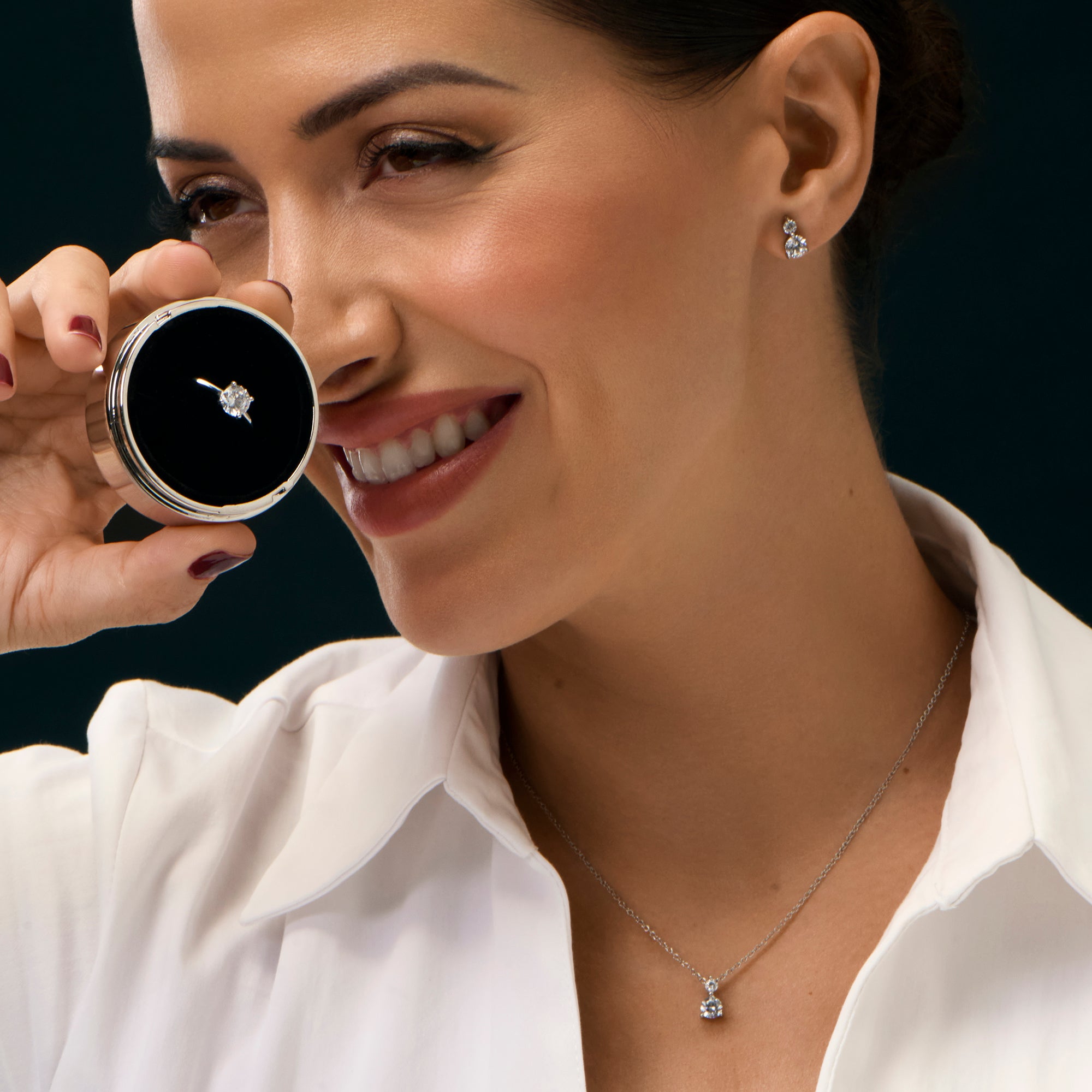 Cubic zirconia solitaire jewelry set with stainless steel pendant necklace, stud earrings and matching ring, timeless minimalist design with brilliant diamond-like stone.
