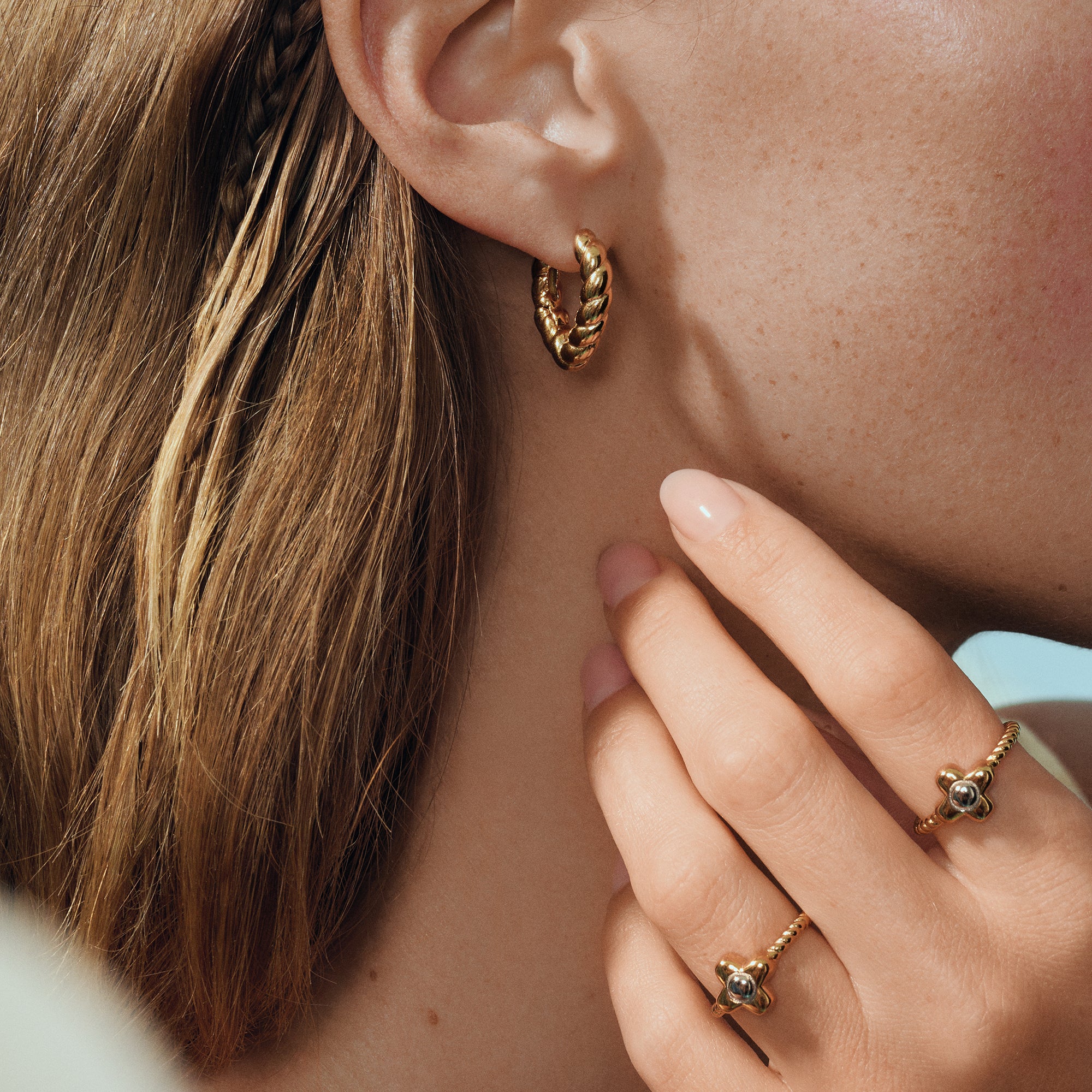 Gold twisted flower ring in surgical stainless steel, hypoallergenic jewelry for sensitive skin, affordable and tarnish free.