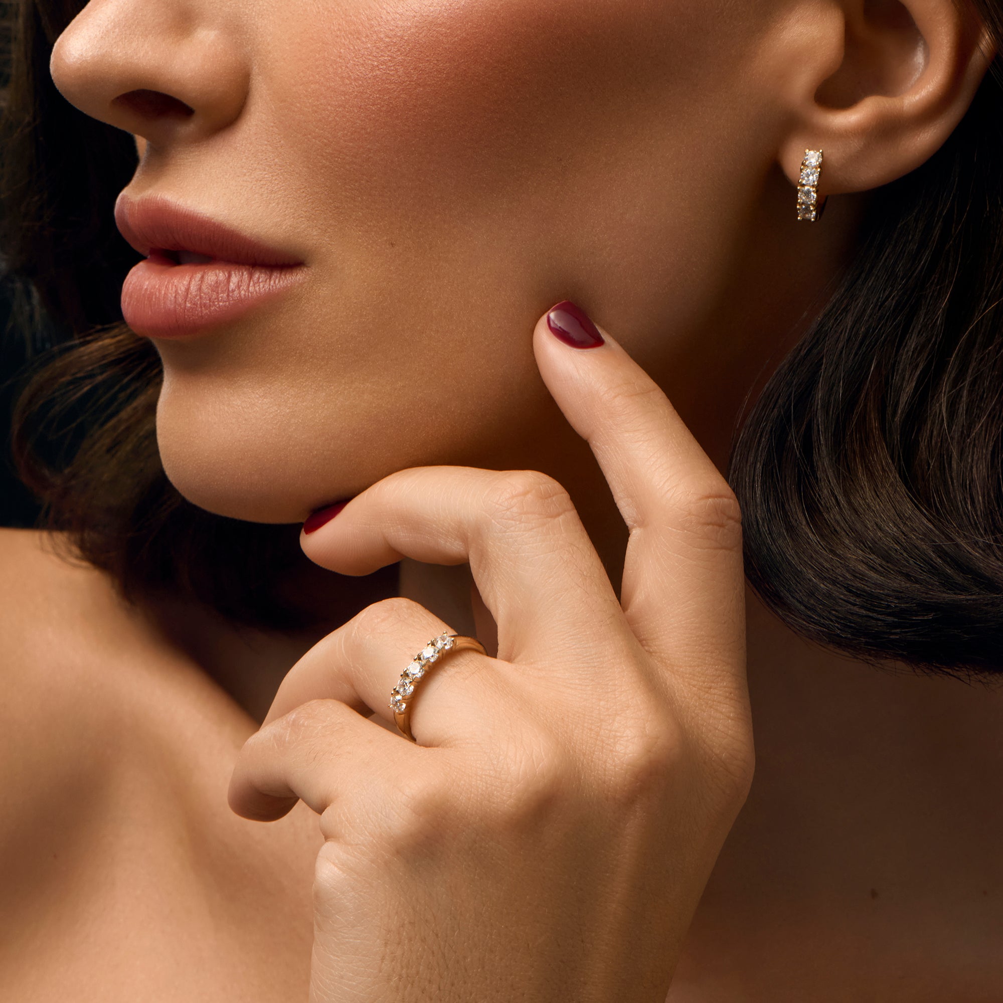 Gold cubic zirconia hoop earrings and matching five stone band ring in stainless steel, elegant hypoallergenic jewelry for sensitive skin, non tarnish durable jewelry Canada Toronto.